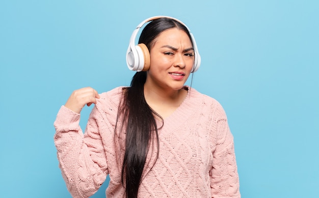 Hispanic woman feeling stressed, anxious, tired and frustrated, pulling shirt neck, looking frustrated with problem