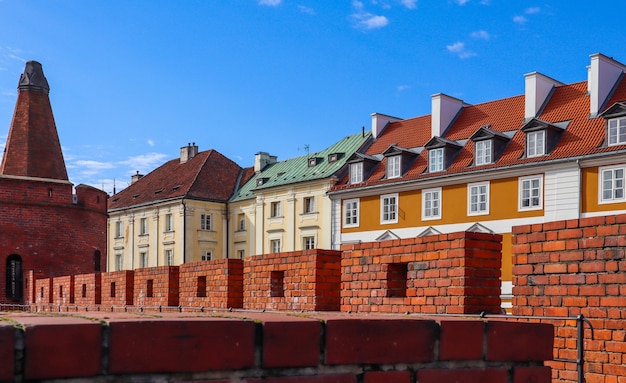 Historic buildings and red brick walls of warsaw barbican poland