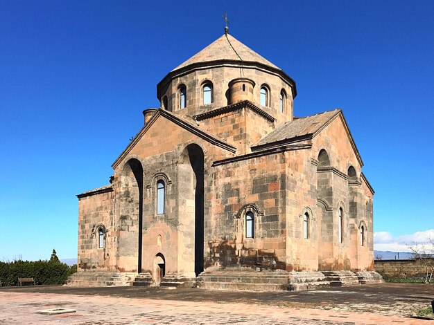 Historic church against clear blue sky