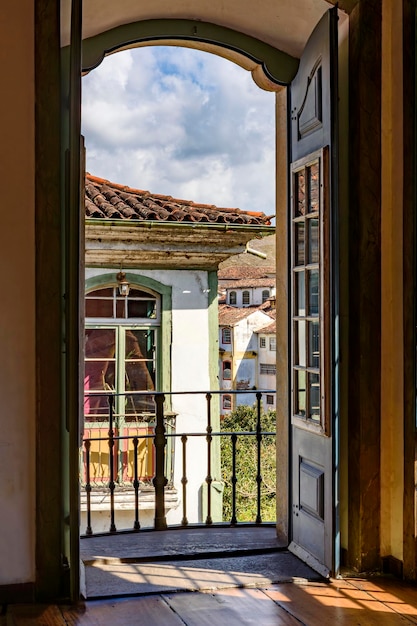 Historic city of Ouro Preto seen through the doors of a house