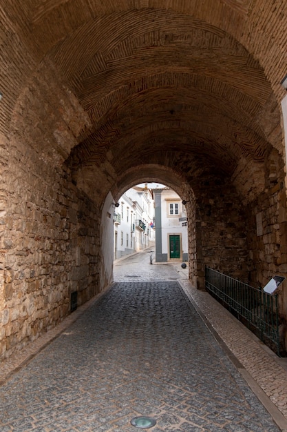 Historical arch of Vila entrance to the oldtown of Faro city, Portugal.