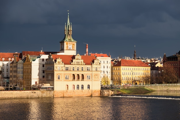 Historical buildings in Prague on a sunset after a storm