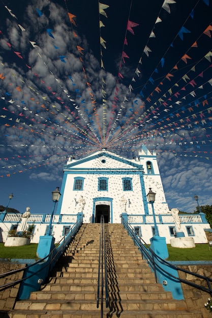Historical church adorned with colorful flags