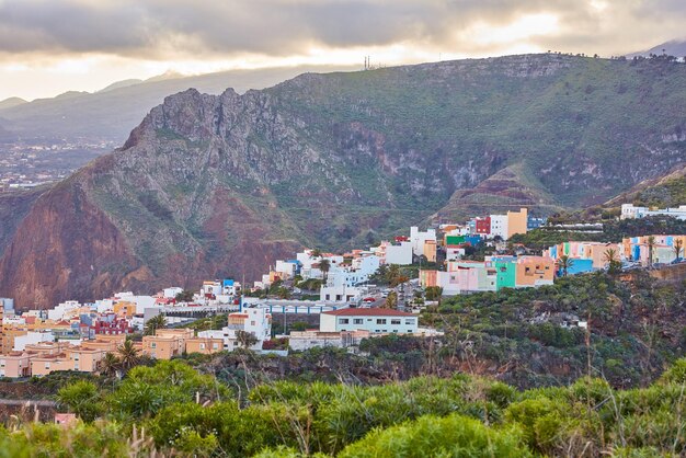 Historical spanish or colonial architecture in tropical village in tourism destination City and mountain view of residential houses or buildings in serene hill valley in Santa Cruz La Palma Spain