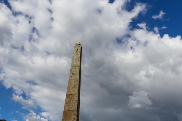 Historical stone tower against sky and cloud