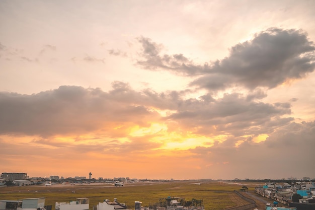 Ho chi minh city vietnam feb 12 2022 airplane fly over urban
areas preparing landing into tan son nhat international airport and
takes off in tsn airport