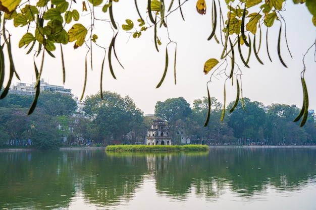 Hoan Kiem Lake Ho Guom or Sword lake in the center of Hanoi in the fog in the morning Hoan Kiem Lake is a famous tourist place in Hanoi Travel and landscape concept Selective focus