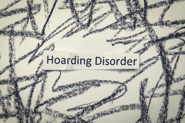 Hoarding disorder handwritten sign mental health problem when people collect different useless things