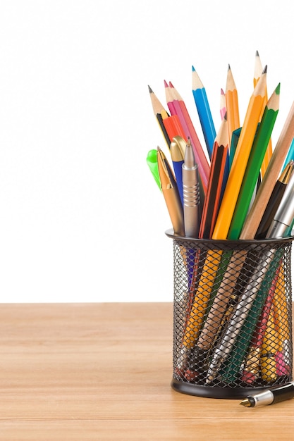 Holder basket and office supplies on wood board