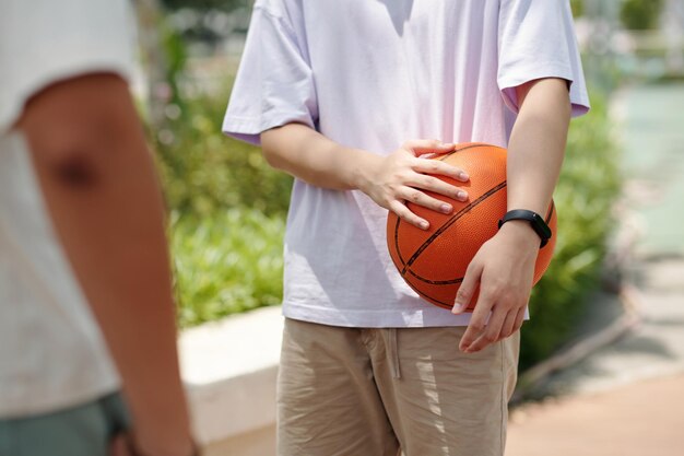 Holding Basketball in One Hand Outdoors Without Looking