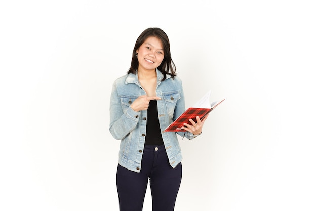 Holding book of Beautiful Asian Woman Wearing Jeans Jacket and black shirt Isolated On White