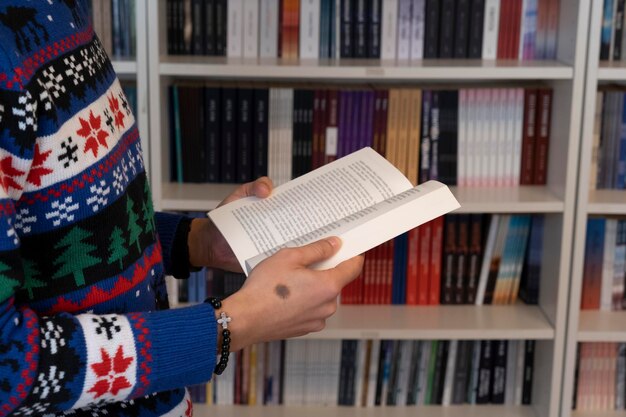 Holding a book in the library