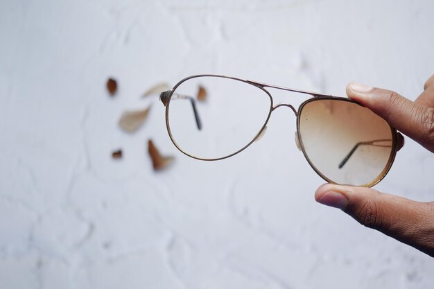 Holding a broken eye glass top view