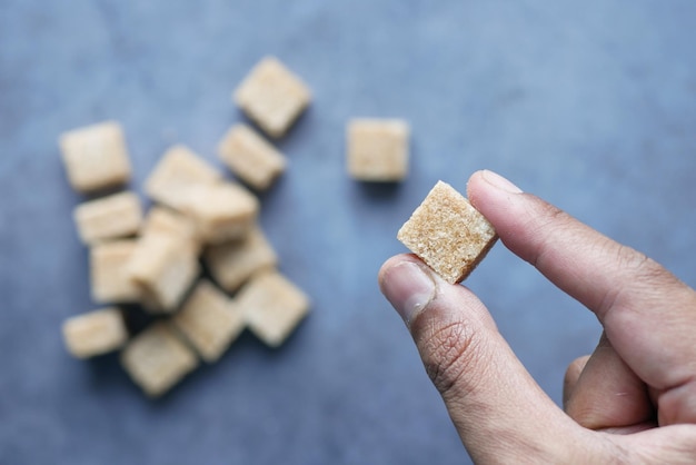 Holding a brown sugar cube top view