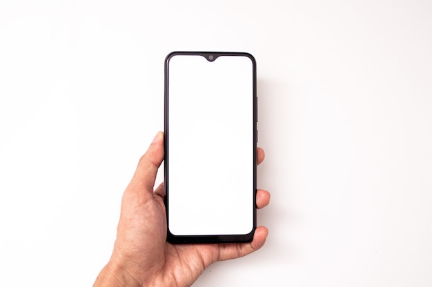 holding a cell phone on a white background