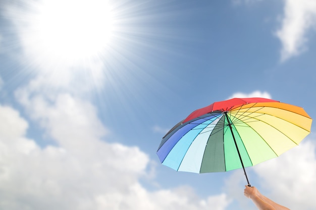 Photo holding colorful umbrella for protection uv light.