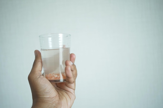 Holding dirty glass of water