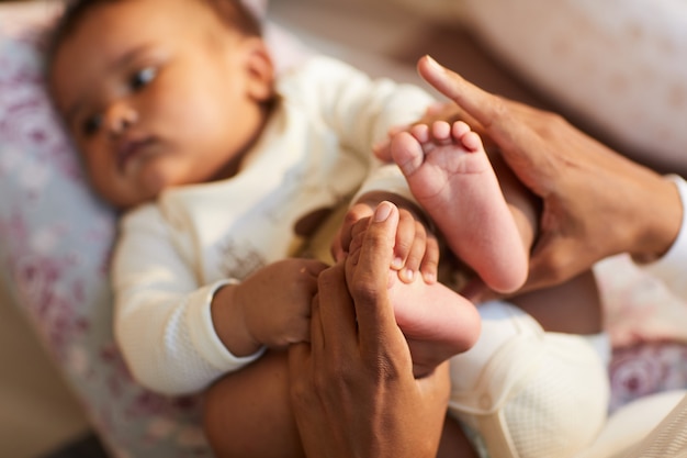 Holding feet of baby