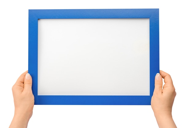 Holding frame mockup Photo Mockup Woman hands hold blue frame For frames and posters design Frame size A4 isolated on white background blank photo frame border with copy space in hands close up