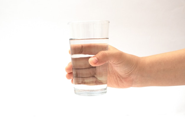 Holding a glass cup on a white background