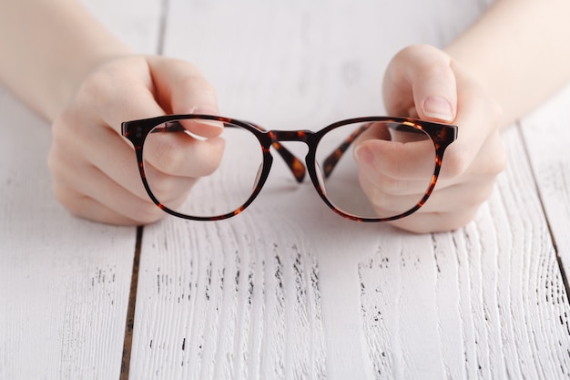 Holding glasses in female hands