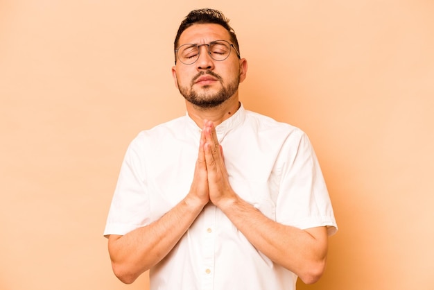 Holding hands in pray near mouth feels confident