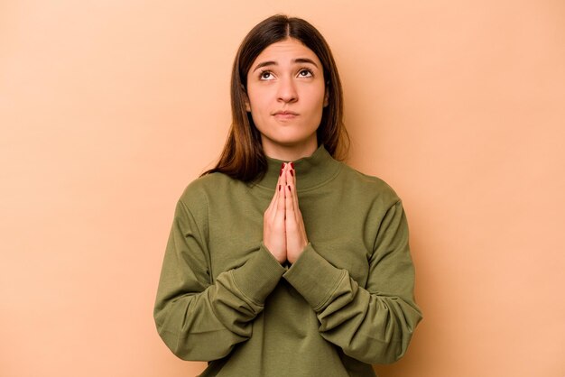 Holding hands in pray near mouth feels confident