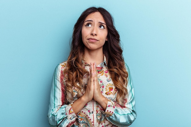 Holding hands in pray near mouth feels confident