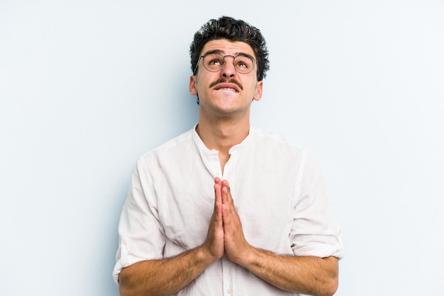 Holding hands in pray near mouth feels confident