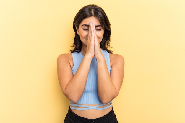 Holding hands in pray near mouth feels confident