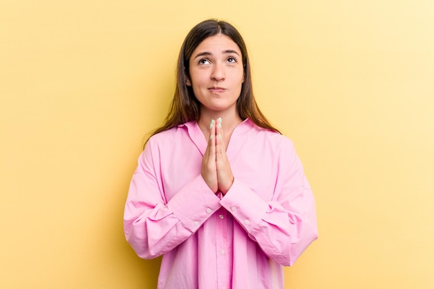 Holding hands in pray near mouth feels confident