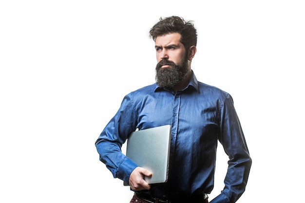 Holding laptop computer. Serious handsome bearded man worker laptop.