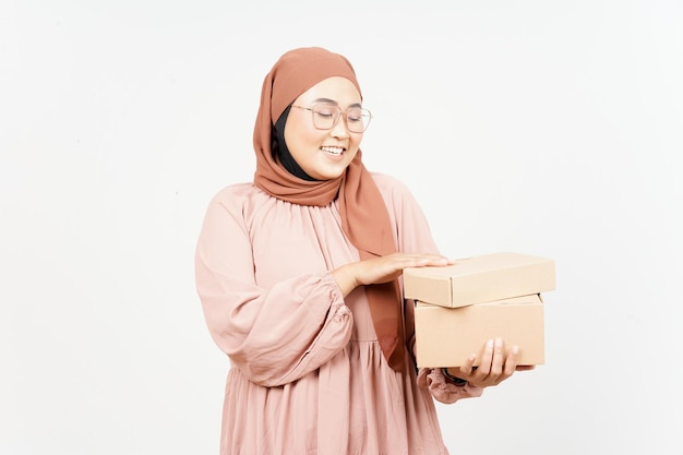 Holding Package Box or Cardboard Box of Beautiful Asian Woman Wearing Hijab Isolated On White