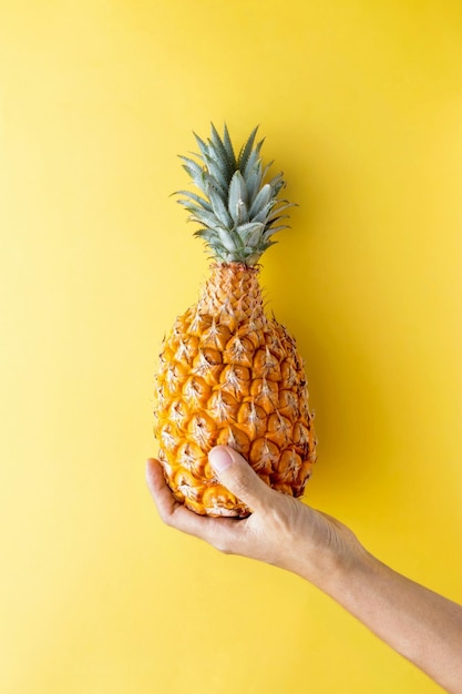 Holding pineapple