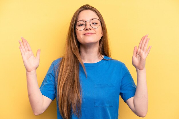 Photo holding something little with forefingers smiling and confident