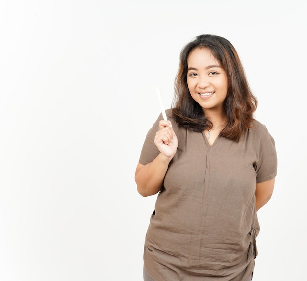 Holding toothbrush and smile of Beautiful Asian Woman Isolated On White Background