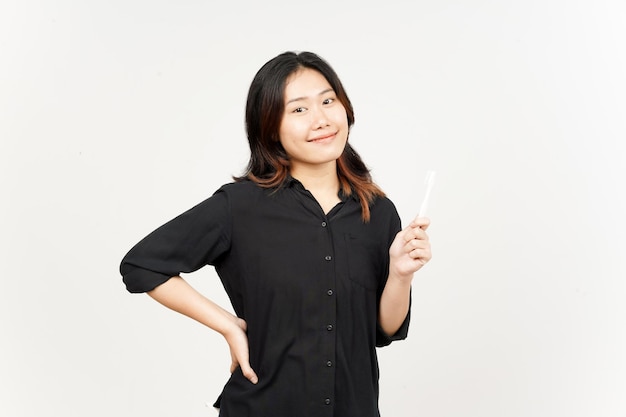 Holding toothbrush and smiling to camera of Beautiful Asian Woman Isolated On White Background