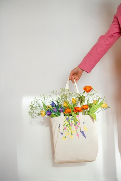 Holding totebag filled with flowers