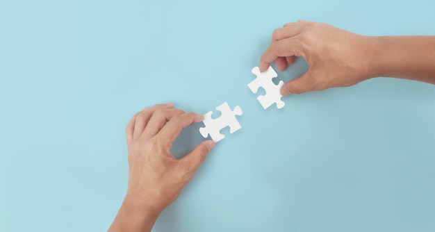 Holds in hand  jigsaw puzzle. Business solutions success and strategy concept