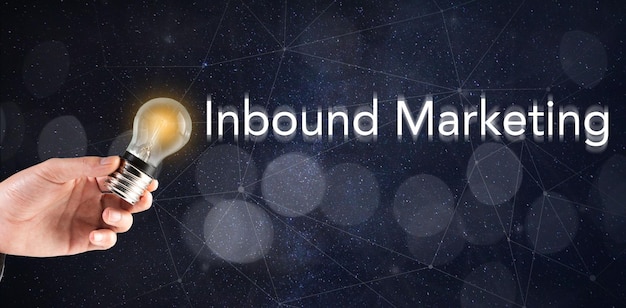 Photo holds a light bulb and inbound marketing