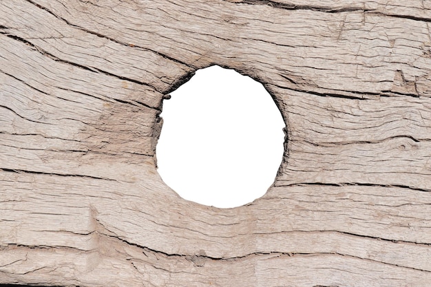 Hole in old wooden fence