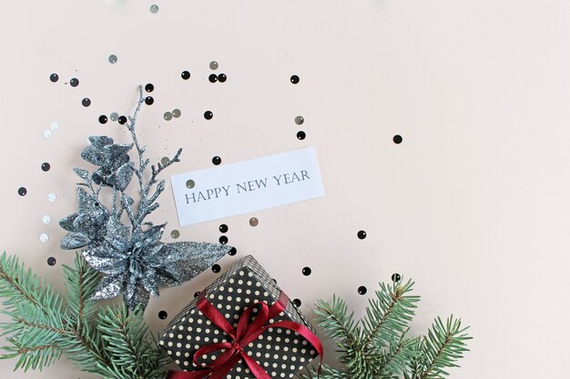 Holiday background. New year and Christmas. confetti, gift and pine. top view. Flat lay concept.