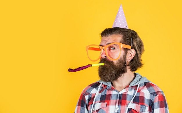 Holiday celebration happy birthday to you corporate party celebrate hello summer summer vacation party feel the happiness happy man with beard man in party glasses with horn copy space