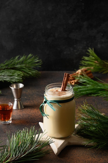 Holiday Christmas eggnog beverage in mason jar for adults with alcohol