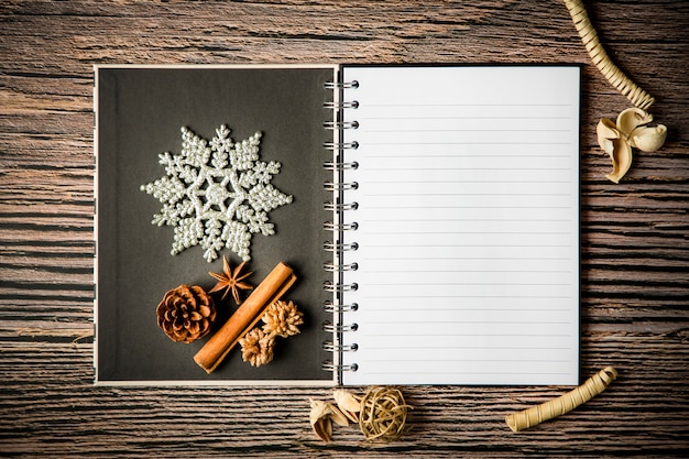 holiday christmas frame card and vintage blank open book notes on the dark table
