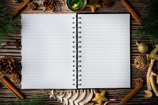 holiday christmas frame card and vintage blank open book notes on the dark table