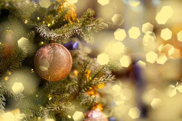 Holiday decorations for the Christmas tree. Blurred holiday background.