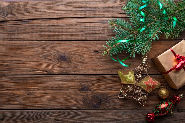 Photo holiday frame of christmas decorations on old wood background