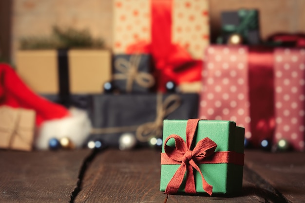 Holiday gift boxes on wooden table. Image in vintage color style