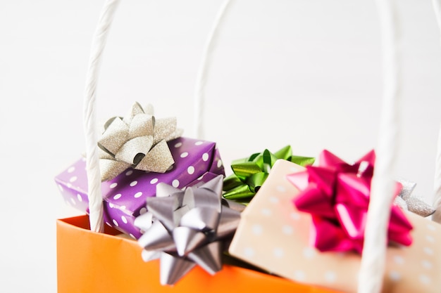 Photo holiday gifts in paper bag, closeup view